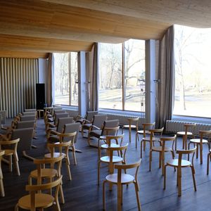 Empty, spacious room with natural light from a large window.